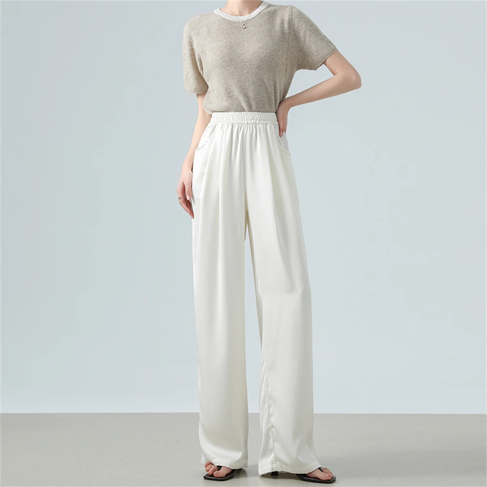 Jedwabiste, gładkie spodnie z szerokimi nogawkami, elastyczną talią, luźnym krojem, zdobione kwiatowym wzorem, codzienne spodnie damskie na wiosnę.