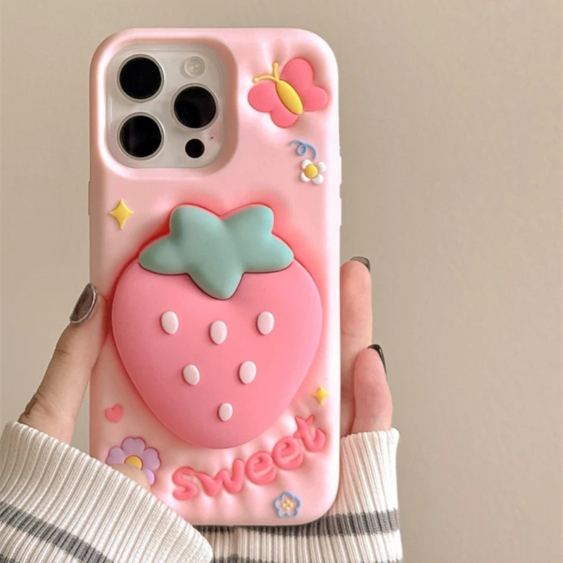 

Cute 3D Cartoon Strawberry Hand Grip Holder Soft Silicone Case For iPhone 16 15 13 14 Pro Max Shockproof Back Cover