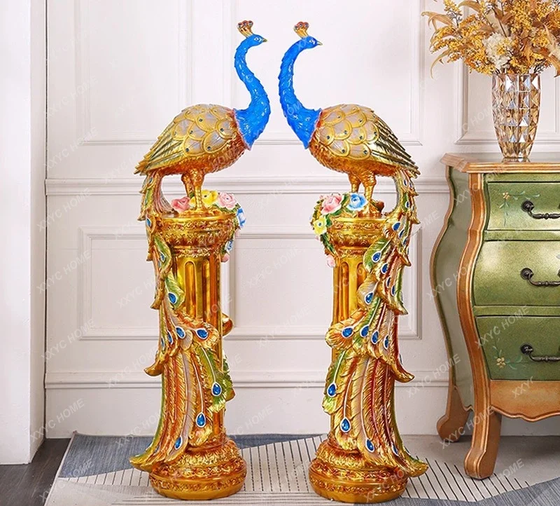 A Floor-to-ceiling ornament next to the TV cabinet in the living room, peacock ornament