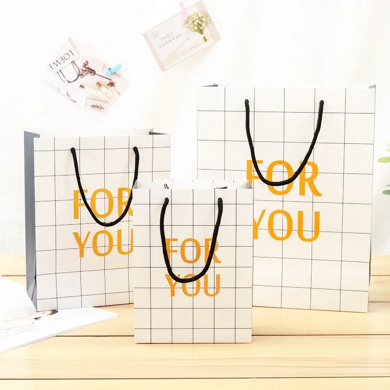 

10pcs Simple and stylish white plaid paper bag Vertical Version Gift Bag Paper Handbags Children's Day Portable Gift Bag