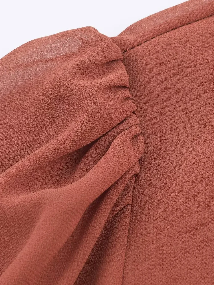 New European-style women's dress, fashionable and versatile, featuring an elegant design with ruffled details and long sleeves.