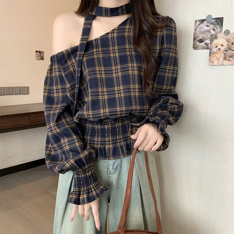 2025 Otoño e Invierno nueva camisa de manga larga con hombros oblicuos irregulares Top de cintura a cuadros Retro para mujer