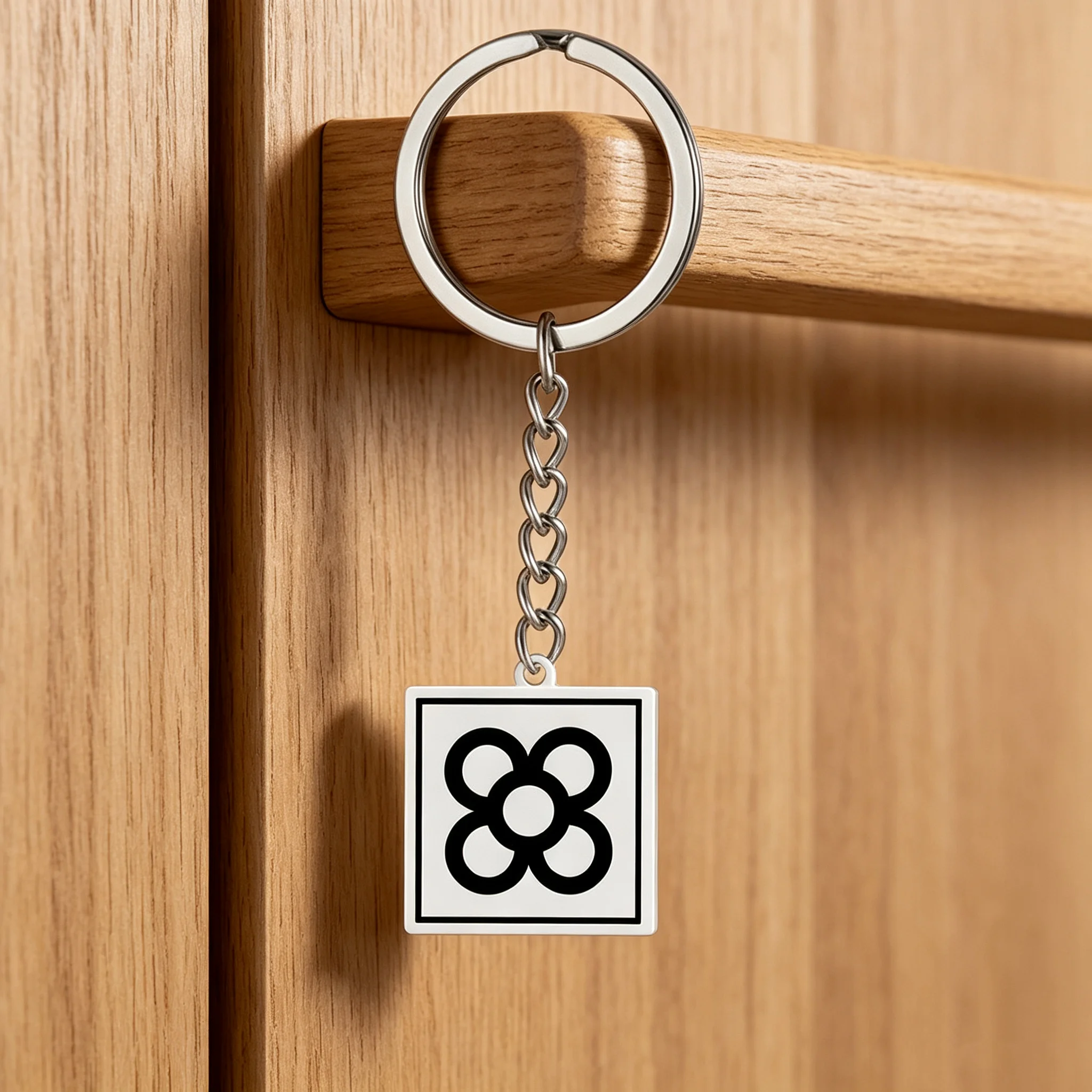 A stainless steel Barcelona flower keychain as a souvenir gift for men and women