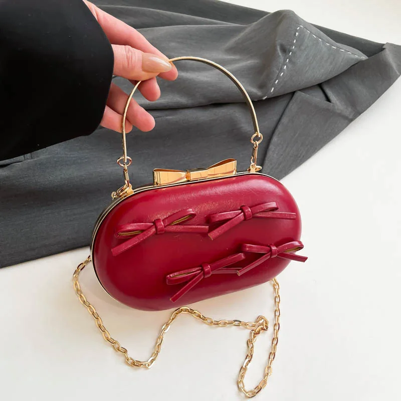 

Сумка на плечо из искусственной кожи с милым бантом и серебряным зажимом и пряжкой, дизайнерская сумка на плечо из искусственной кожи с цепочкой под мышками, женские вечерние модные аксессуары