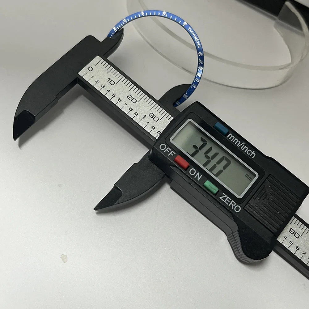 الإطار المسطح المصنوع من الألومنيوم بقطر خارجي 38.5 مم باللونين الأسود والأزرق مناسب لمكونات ساعة الكرونوغراف VK63