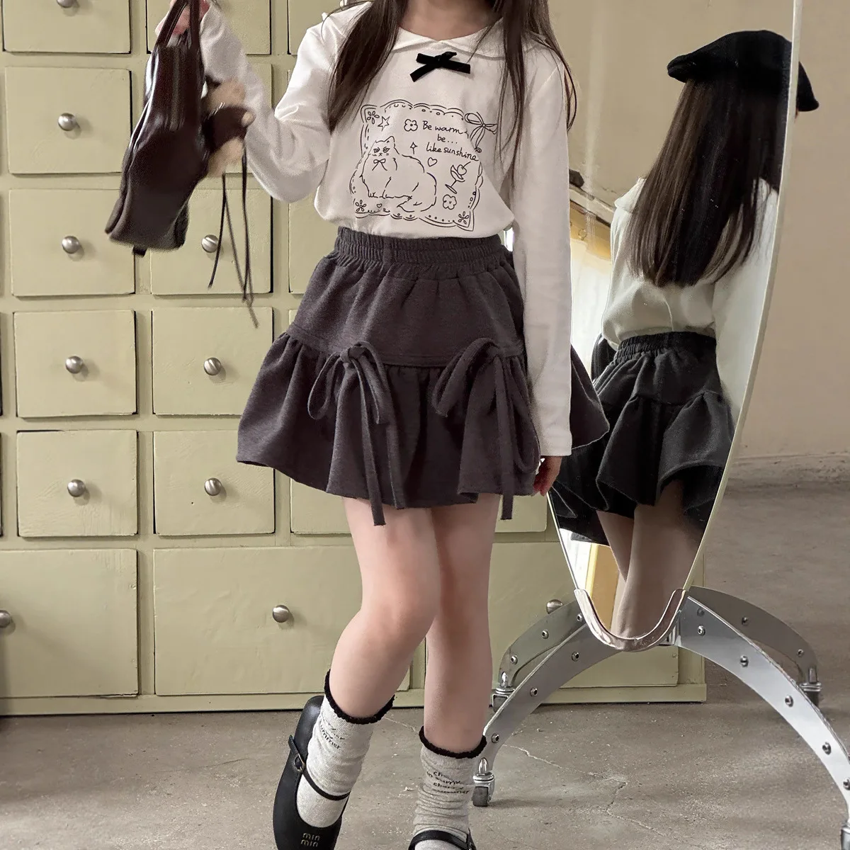 الفتيات الخريف والشتاء النسخة الكورية الجديدة من مرحة القوس حزام تنورة صوفية كلمة تنورة قصيرة أزياء عارضة