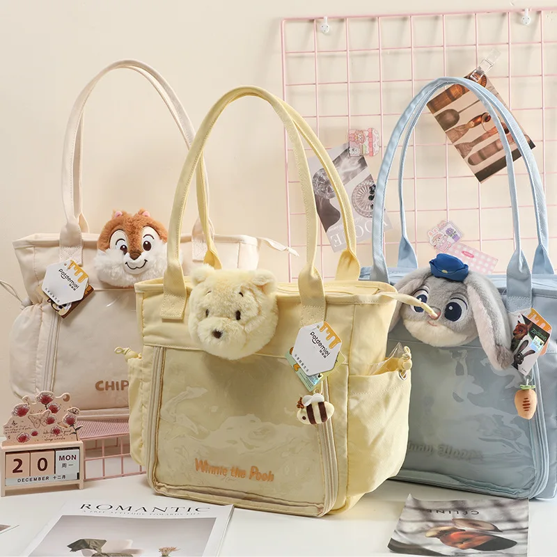 กระเป๋าสะพายไหล่ดิสนีย์ของแท้ล็อตโซ วินนี่ เดอะ พูห์ จูดี้น่ารักน้ำหนักเบาความจุขนาดใหญ่พร้อมกระเป๋าถือจี้ตุ๊กตา