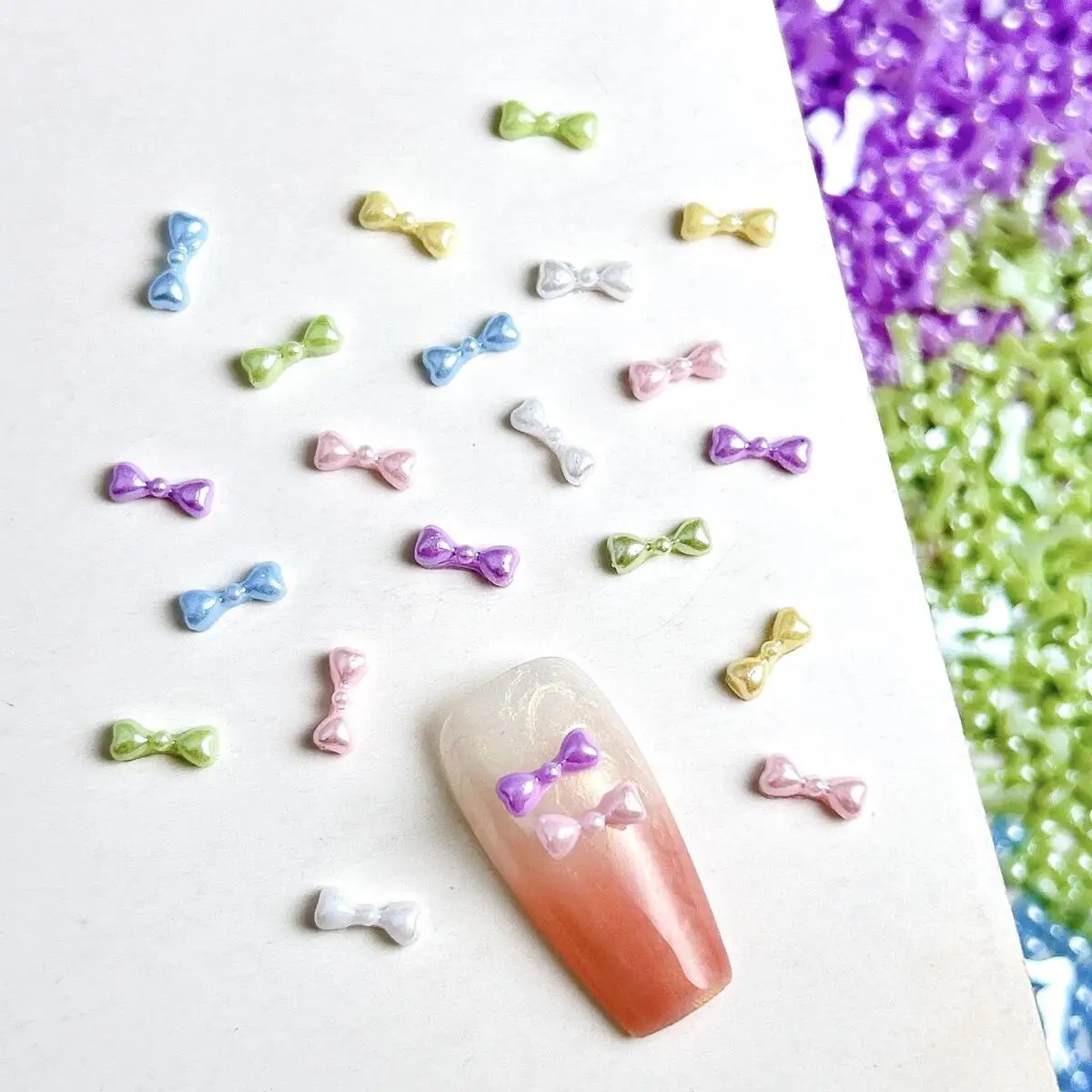 โบว์เรซิ่นขนาดเล็กน่ารัก 100 ชิ้น สีพื้น แต่งเล็บ สไตล์หวาน สำหรับตกแต่งเล็บ ทำเคสมือถือ และงานประดิษฐ์อื่นๆ