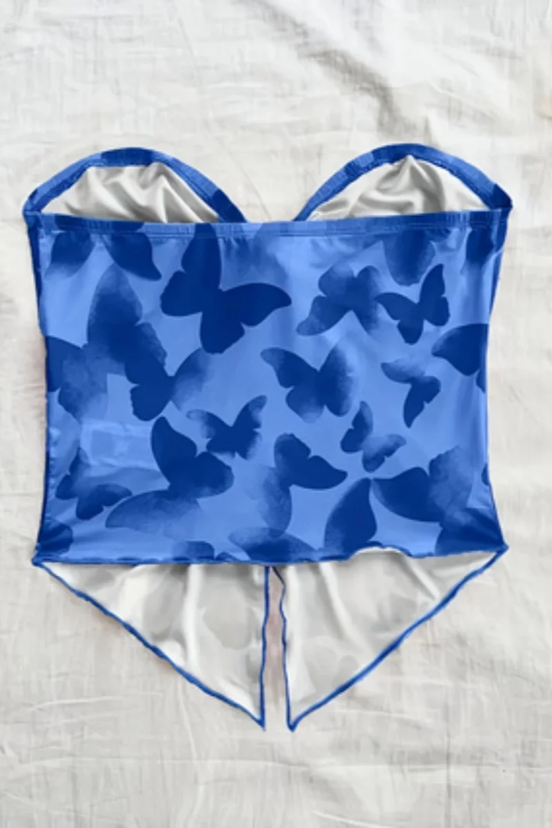 Top feminino elegante sem alças com ombro de fora e um pescoço