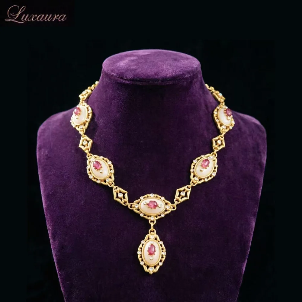 

Vintage jewelry featuring a fashionable and classic gold geometric necklace design paired with Bohemian style women's necklace