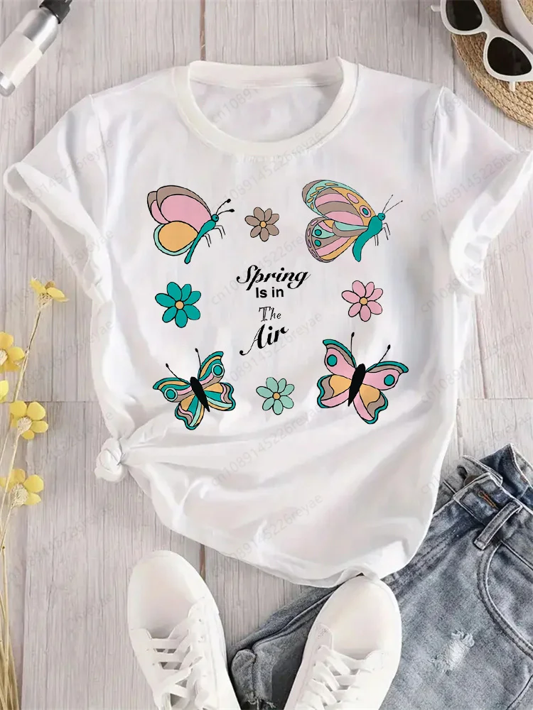 Camiseta de mariposa azul con flores voladoras para mujer, camiseta deportiva elegante con estampado, transpirable, ajuste cómodo, parte superior blanca perfecta para todas las estaciones