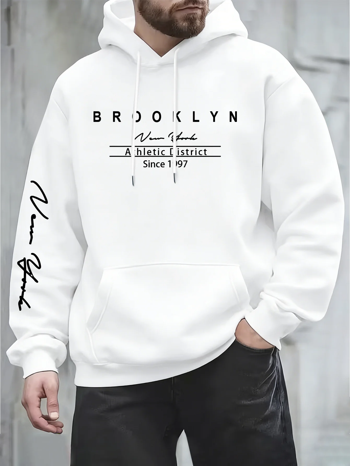 Urban fashion men's hoodie on the streets of New York. Simple text signature print. Loose and comfortable long-sleeved hoodie.