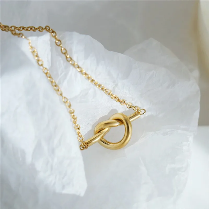 Conjunto de pendientes y collar con colgante de nudo en forma de corazón de acero inoxidable de Color dorado de diseñador para mujer, accesorio de joyería coreana, regalo