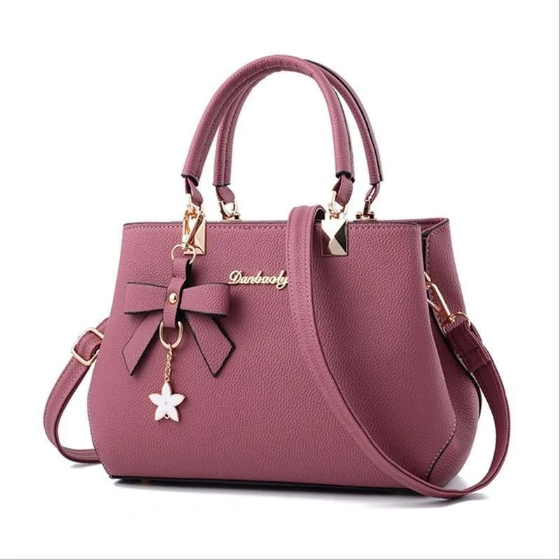 Yogodlns eleganckie damskie torby kurierskie z zawieszką w kształcie kwiatu biurowa, damska skrzynki torebka z czystej skóry dla kobiet Crossbody na ramię