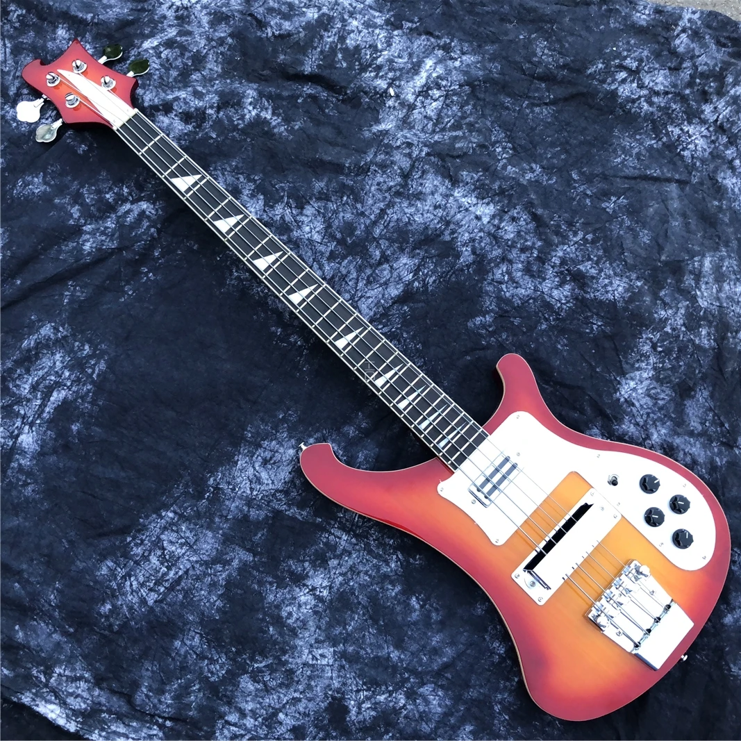 This is a professional 4-string bass electric guitar with a sunset color changing bright face. It has a beautiful tone