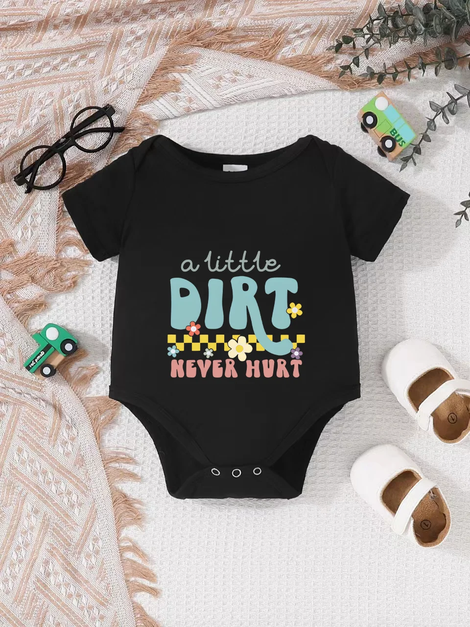 Playful letter-printed baby short-sleeve triangle bodysuit. Button closure for easy dressing