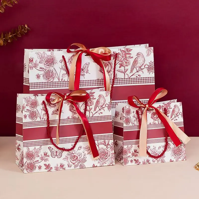 أكياس الهدايا أكياس الهدايا الأزهار الجديدة INS حقيبة حمل الموضة مع حقيبة التعبئة والتغليف الشريط الملابس أكياس التسوق الورقية أكياس الحلوى