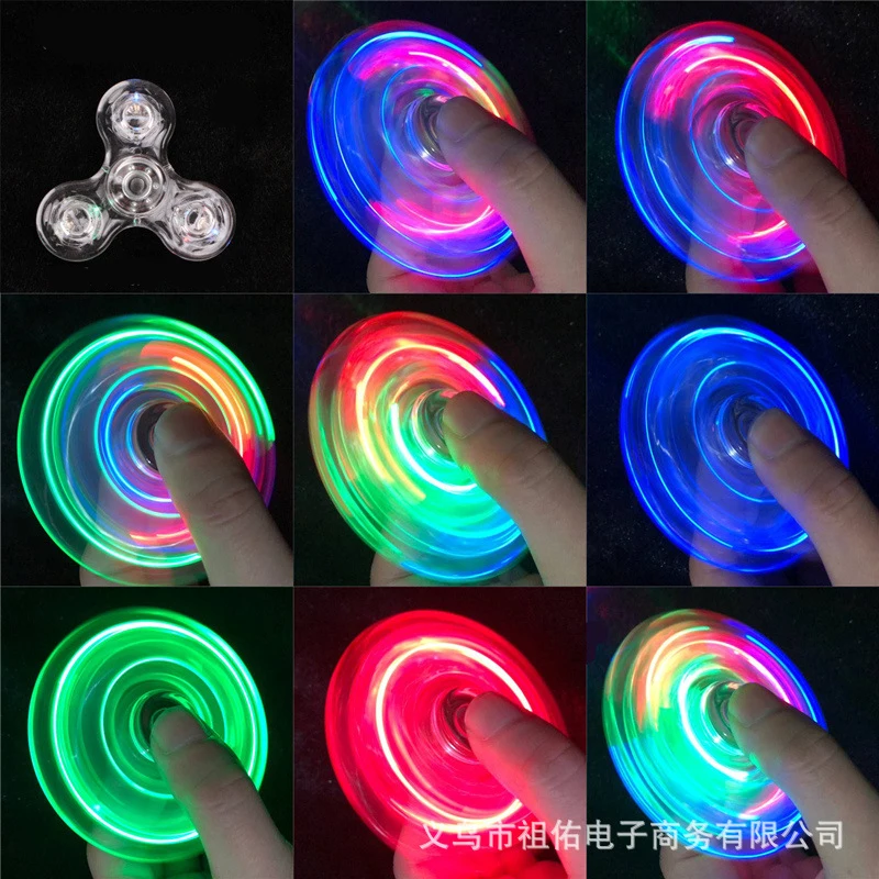 NIEUWE Kristal Lichtgevende LED licht Fidget Spinner Hand Top Spinners Glow in Dark Stress Relief Speelgoed Kinetische Gyroscoop voor Kinderen