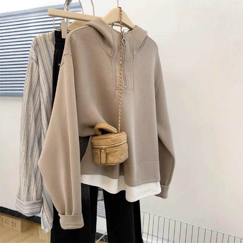 

Женская мода Дизайн Sense Полумолния Поддельный двухсекционный свитшот с капюшоном Ранняя осень Новый стиль Простой свободный универсальный тонкий топ