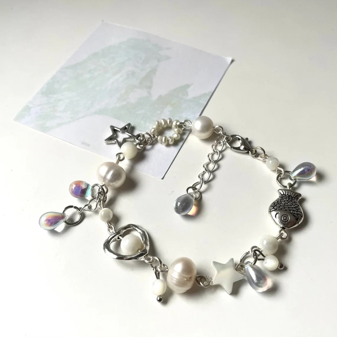 wave to earth bracelet | flaws and all | handmade beaded bracelet | white jewelry | w2e merch