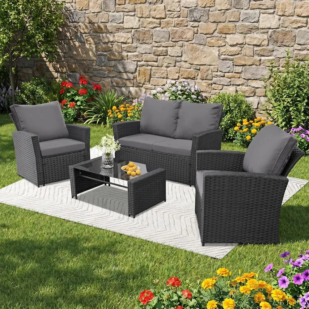 4-Piece Wicker Outdoor Patio Furniture Set with Weather-Resistant Sofa, Cushions, and Glass Table in Black/Grey