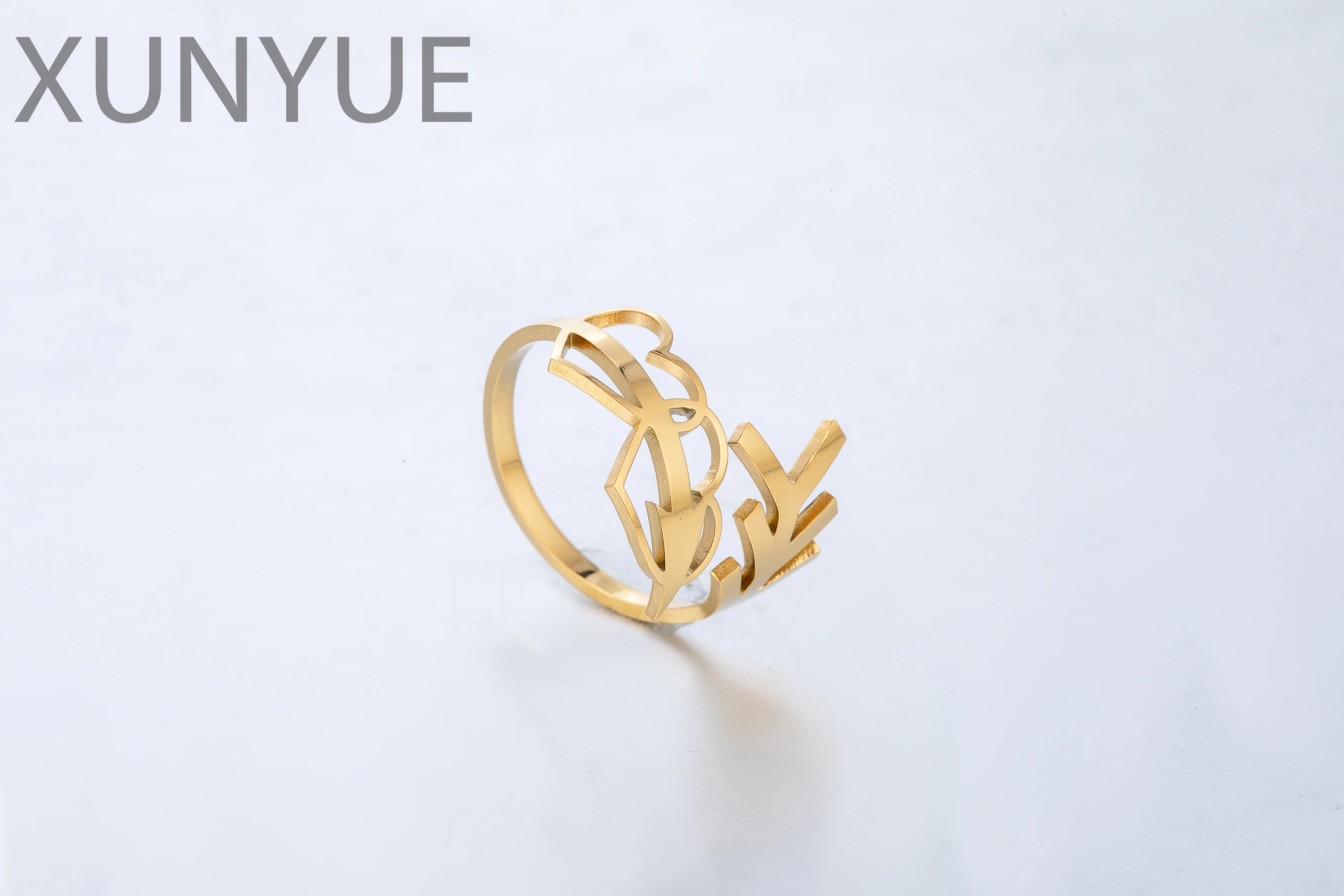 Houwu design sense creative hollow heart opening ring Qiu Bite one of the arrows piercing the heart ring