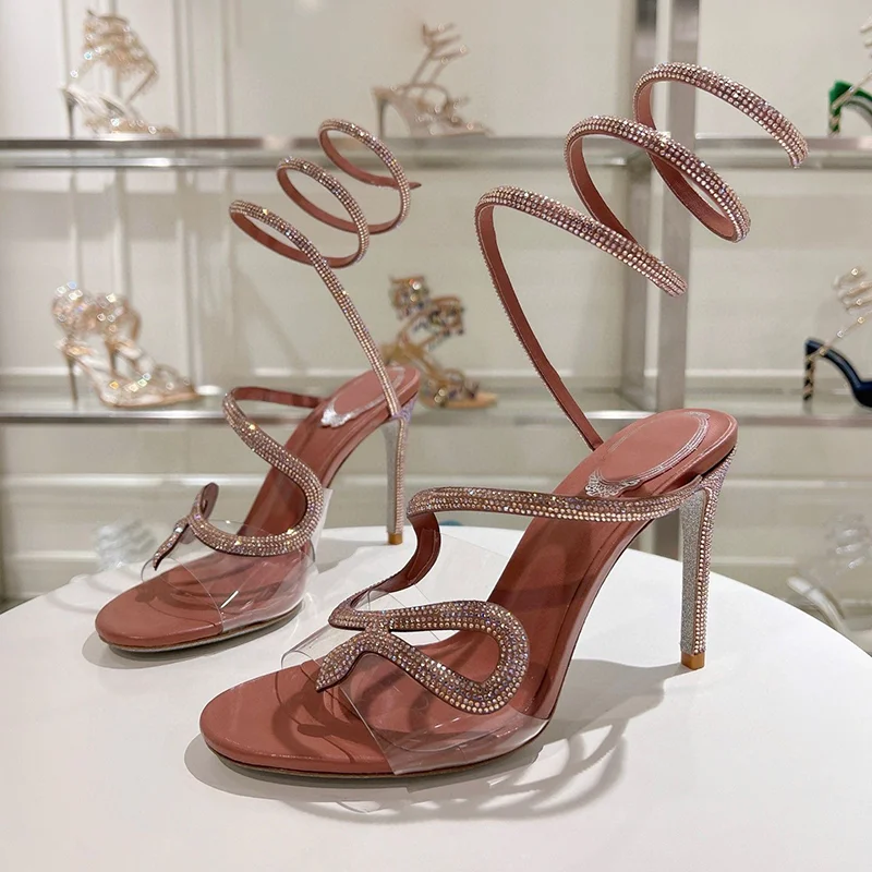 صنادل نسائية صيفية مزخرفة بالكريستال على شكل ثعبان بحزام مطاطي من Sandalias PVC شفافة بحزام واحد وكعب رفيع