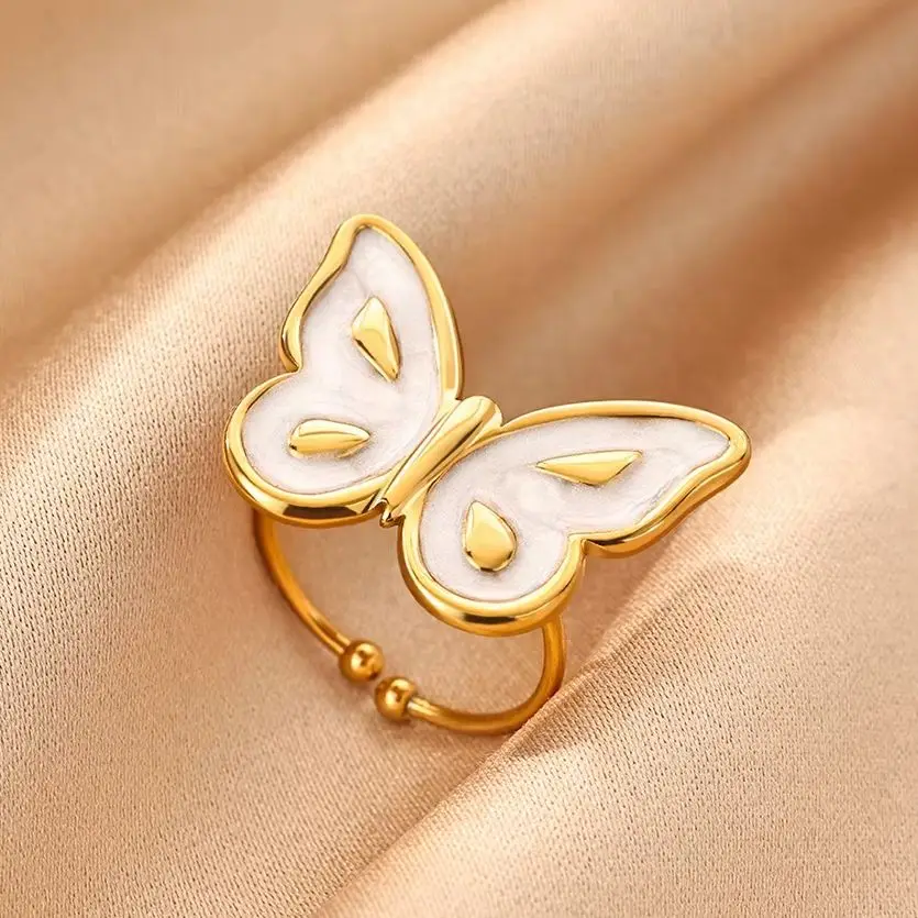 Schicke, weiße Emaille-Schmetterlingsringe für Damen, goldfarben, aus Edelstahl, als modisches Accessoire für den Alltag, ein besonderes Geschenk.