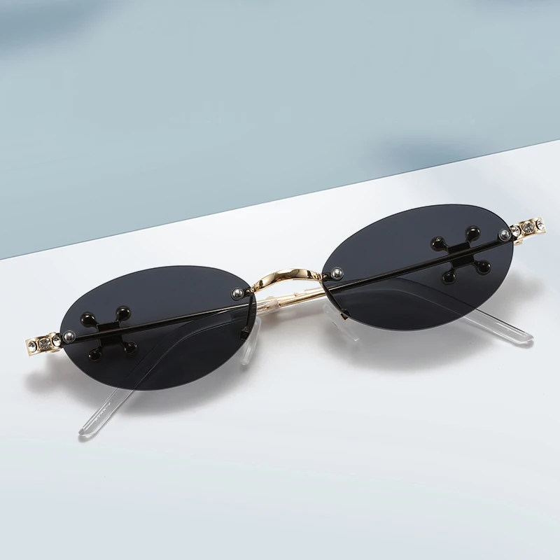 Occhiali protettivi Trend Occhiali da sole con rivetti ovali piccoli senza montatura Occhiali da sole con montatura in metallo di marca Occhiali da sole con diamanti Occhiali trasparenti da donna