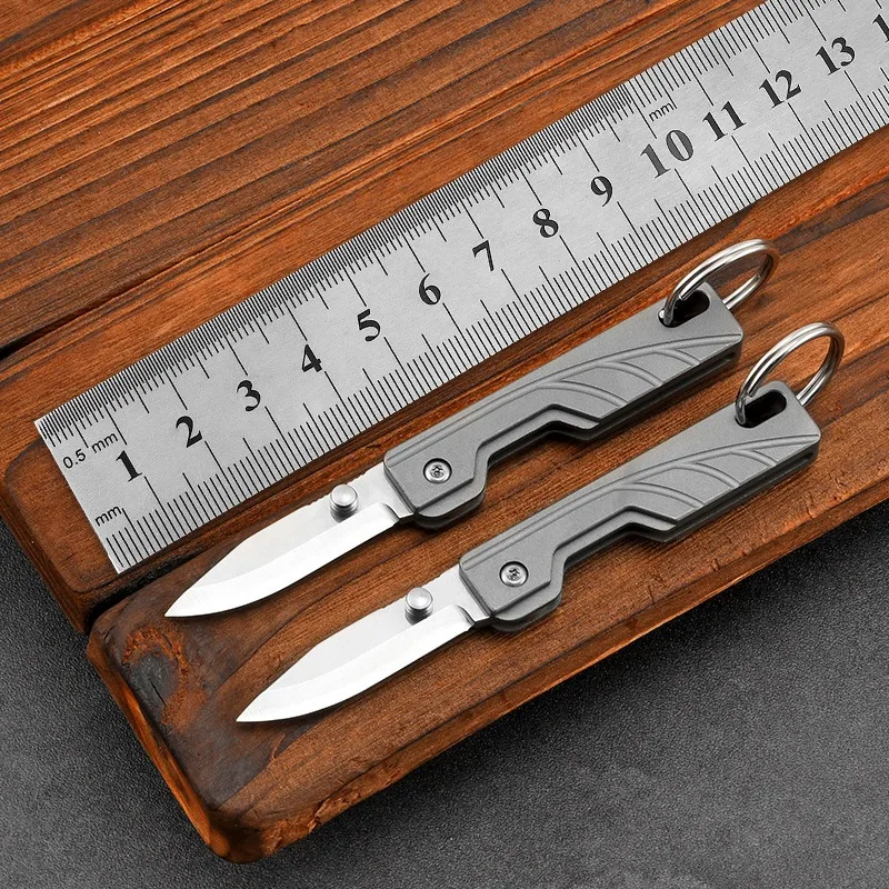 

Titanium alloy knife outdoor defense folding knife carry knife creative pocket knife field camping mini fruit knife