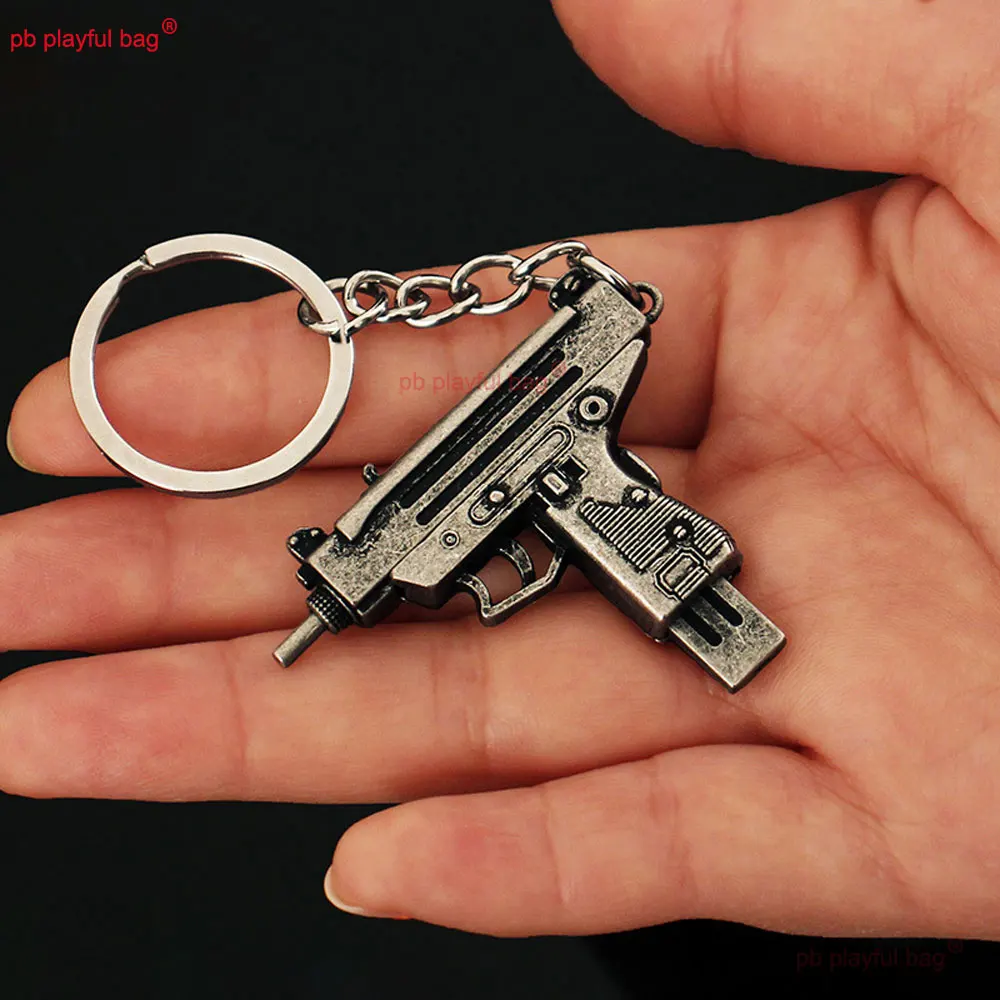 5cm Mini UZI arma de juguete modelo llavero colgante llavero de Metal extraíble decoración manualidades juego figura de acción regalos para niños ZG397