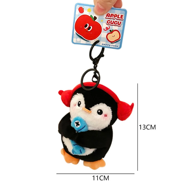 Apple Penguin Plush ของเล่นพวงกุญแจการ์ตูน Penguin ถือปลาตุ๊กตายัดไส้ตุ๊กตาจี้กุญแจรถกระเป๋าเป้สะพายหลังกระเป๋าตกแต่งเด็กของขวัญ