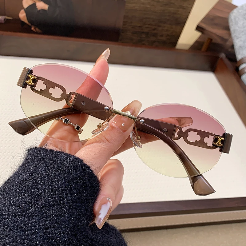2025 New Metal Frameless Sunglasses For Women Sunglasses Fashionable Hollow Elliptical Frame Car Sunglasses 90309