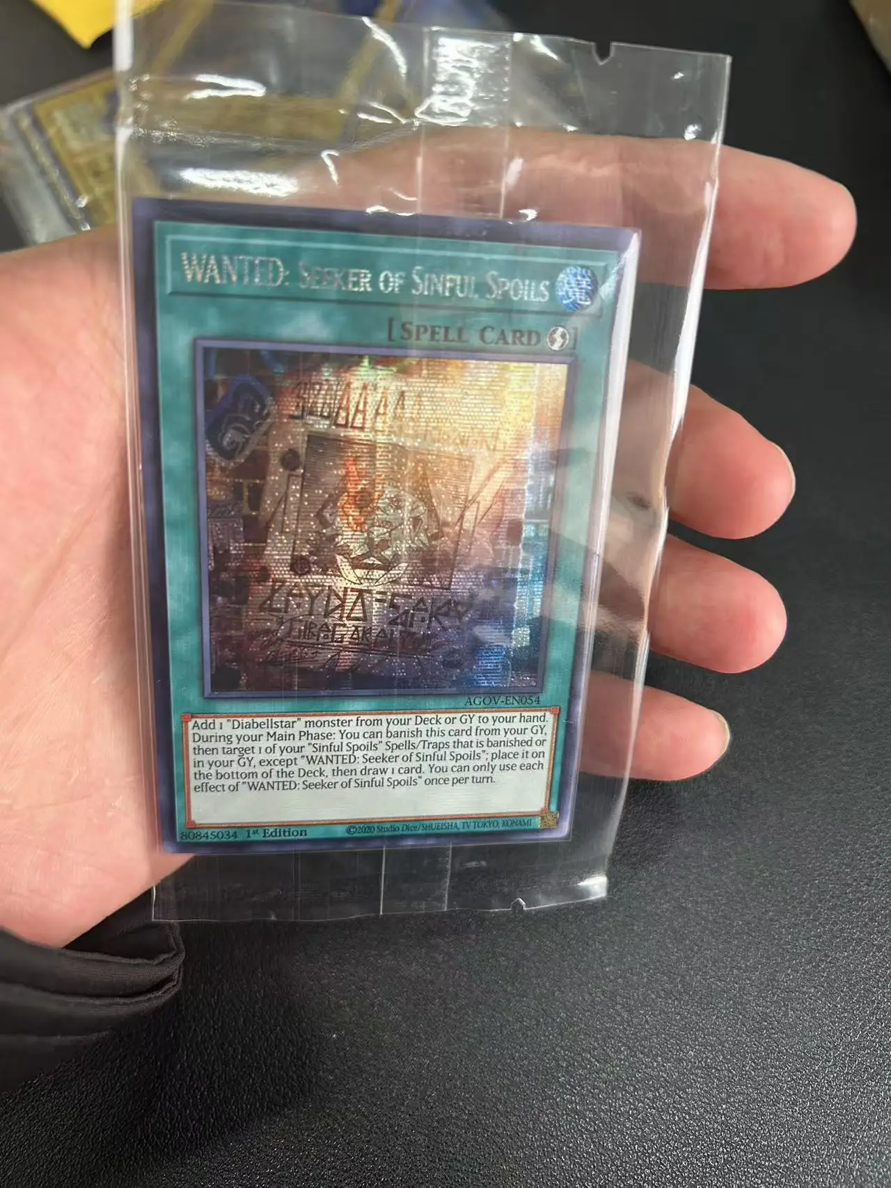 Yu Gi Oh Secret Rare/SER TCG WANTED: Seeker of Sinful Spoils (AGOV-EN054) Игровая карта на заказ с английской коллекцией (не оригинал)