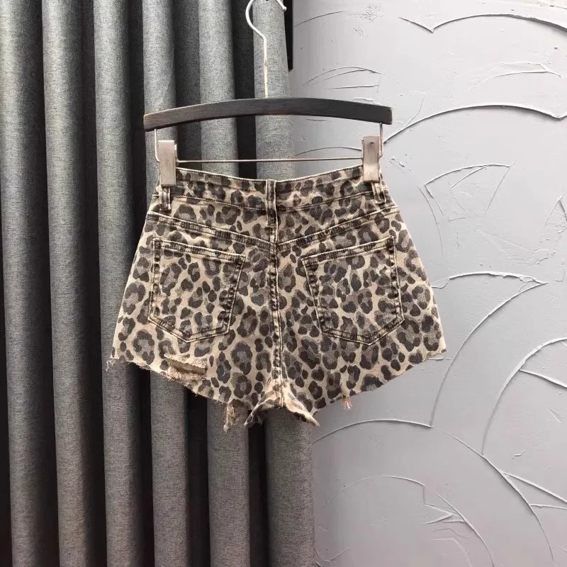 Pantalones cortos vaqueros de cintura alta con estampado de leopardo personalizados, moda de verano para mujer, pantalones vaqueros de pierna ancha con borde áspero, pantalones calientes