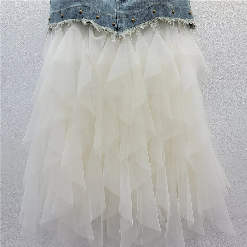 

Sheer Mesh Panel Denim Skirt: A bodycon midi style with a high waist for a sleek, slimming 2025 look.