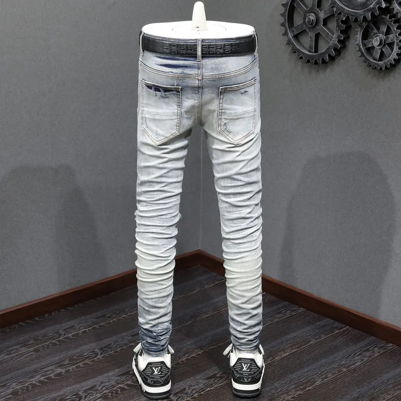 Fashionable new men's jeans with pleats, washed with nostalgia, elastic, slim fit, perforated patches, light blue jeans, high st