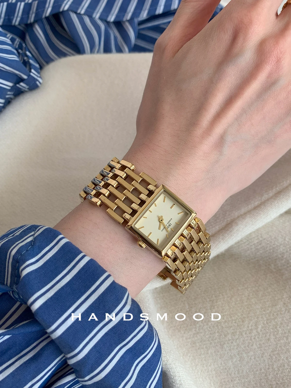 

Square-shaped, sophisticated vintage-style gold-plated openwork steel wristwatch; a high-end women's watch; a gift for women.