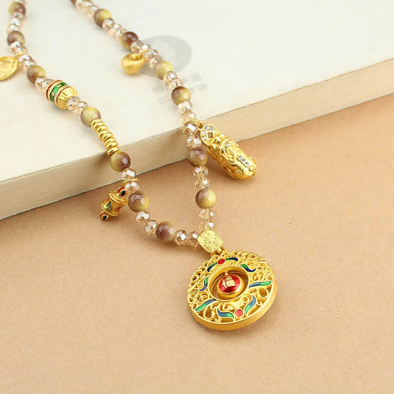 

Аксессуары для самостоятельного изготовления: тибетская цепочка-танка, съемные бусины из имитации золотого тигрового глаза, вращающийся кулон, универсальное украшение.