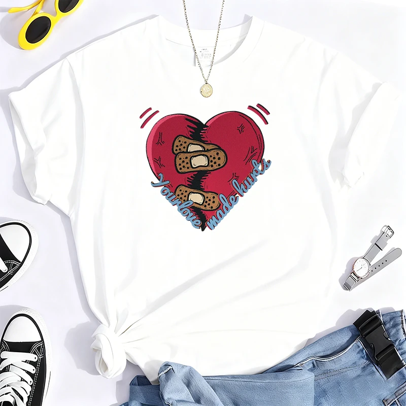 傷ついた心を癒す愛は傷をつける 100% コットン Tシャツ レディース ジョーク ユーモア サマーTシャツ オーバーサイズ カジュアル服 メンズ ストリートウェア