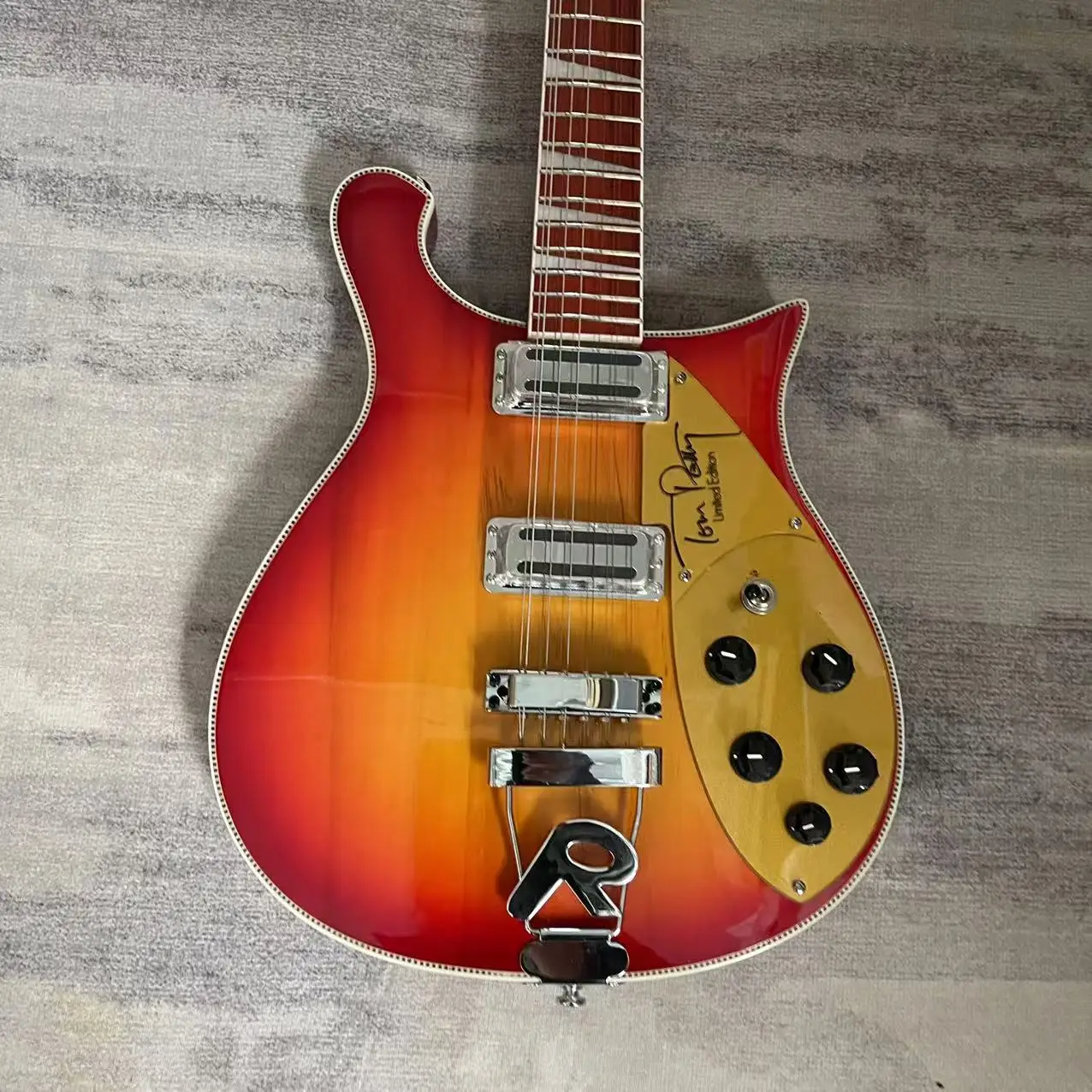 Special shaped electric guitar with tomato colored body, factory's actual shipping pictures, and inventory available. Order and