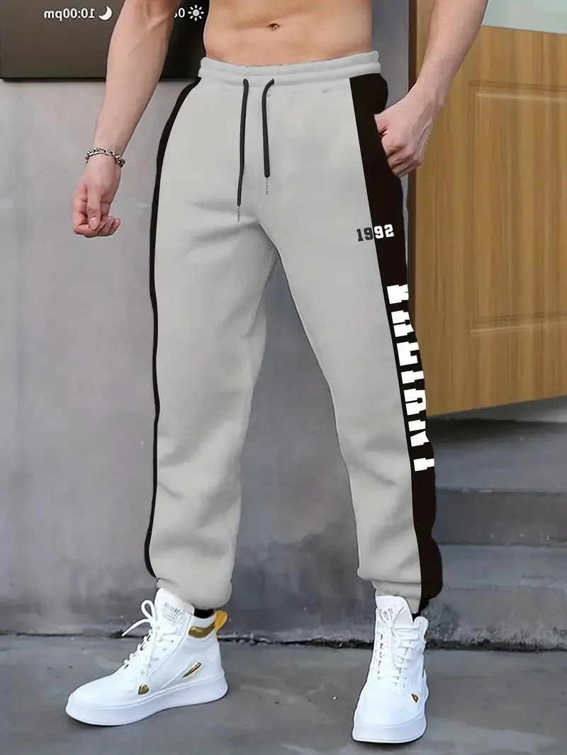 The new men's trousers for Spring and Autumn 2025 are comfortable soft casual and fashionable with letter prints