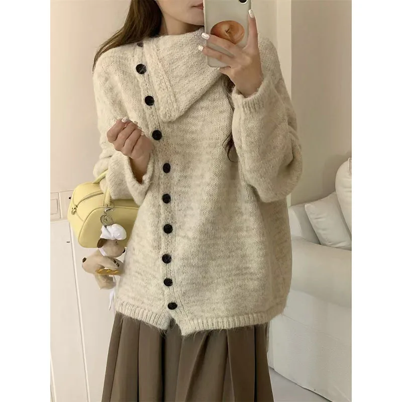 Sweater wanita kerah kancing miring, temperamen wanita musim gugur musim dingin longgar serbaguna lembut lilin mantel Sweater Single-Breasted