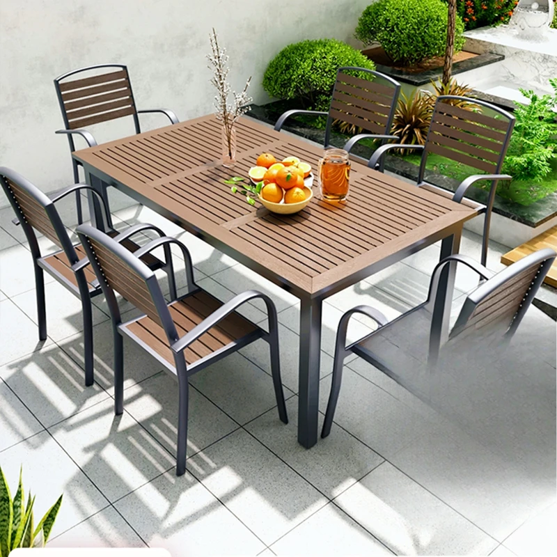 

Outdoor courtyard tables and chairs Outdoor preservative plastic wood dining table and chair set Garden open-air balcony