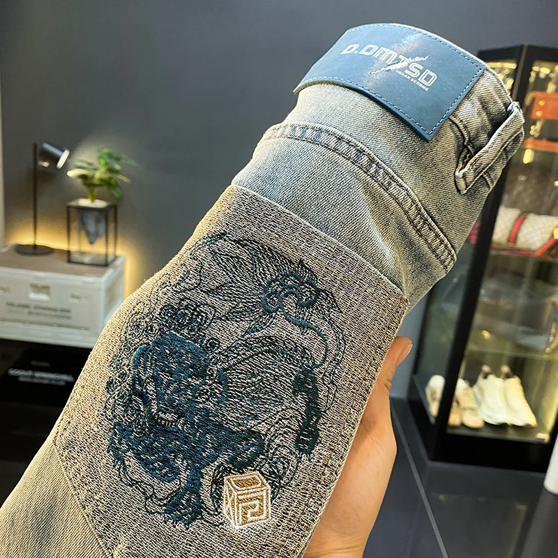 Fashionable high-end handsome jeans men's nine point 2025 summer thin embroidered slim fit trendy brand small foot casual pants