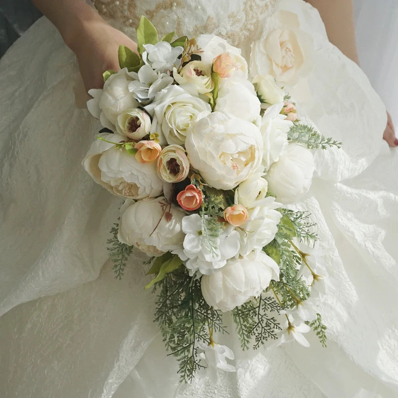 

European and American style high-end artificial bridal bouquet of peonies and roses for wedding photography, with a waterfall-st