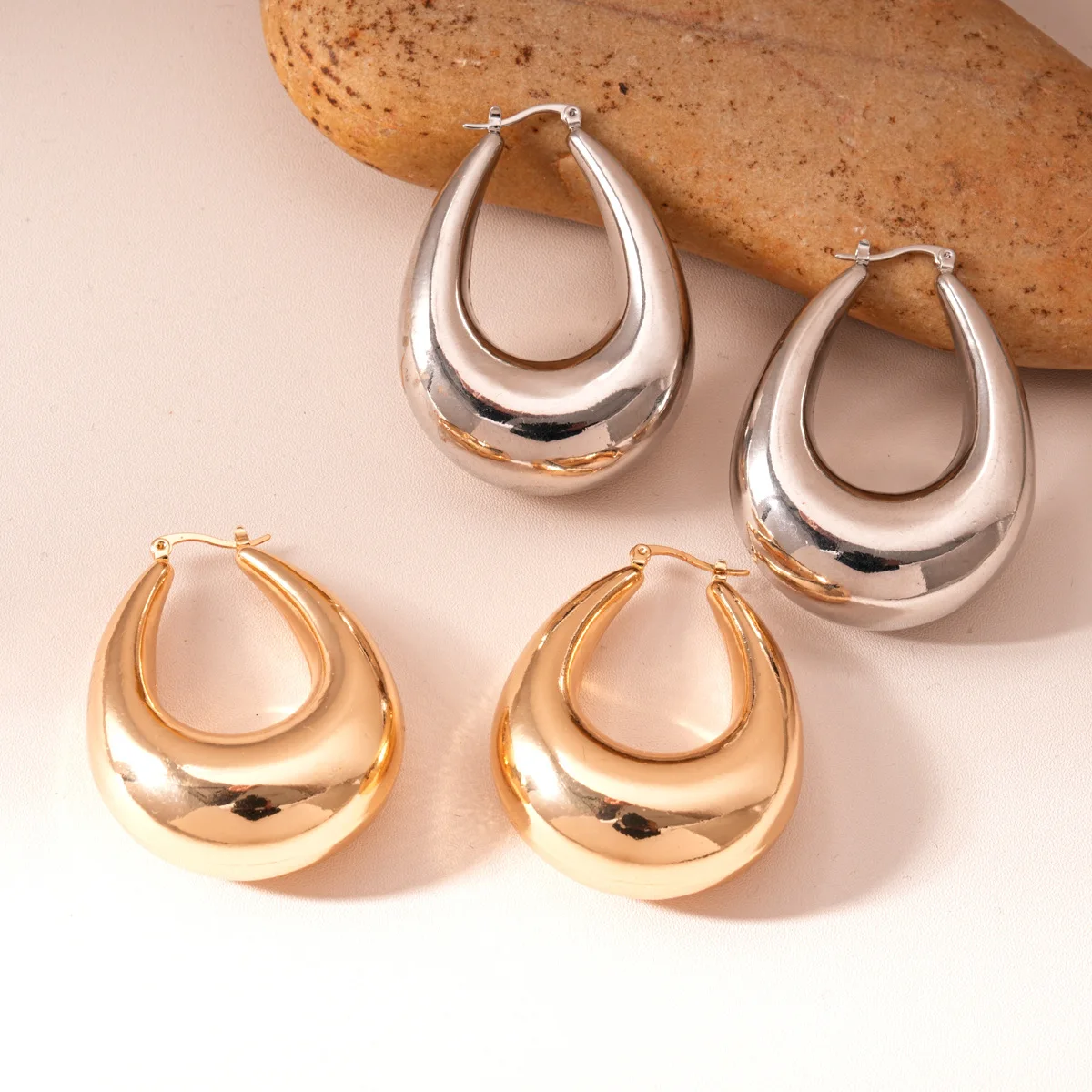 Glossy oval water drop ear buckle cold wind earrings light luxury high-end earrings design sense niche