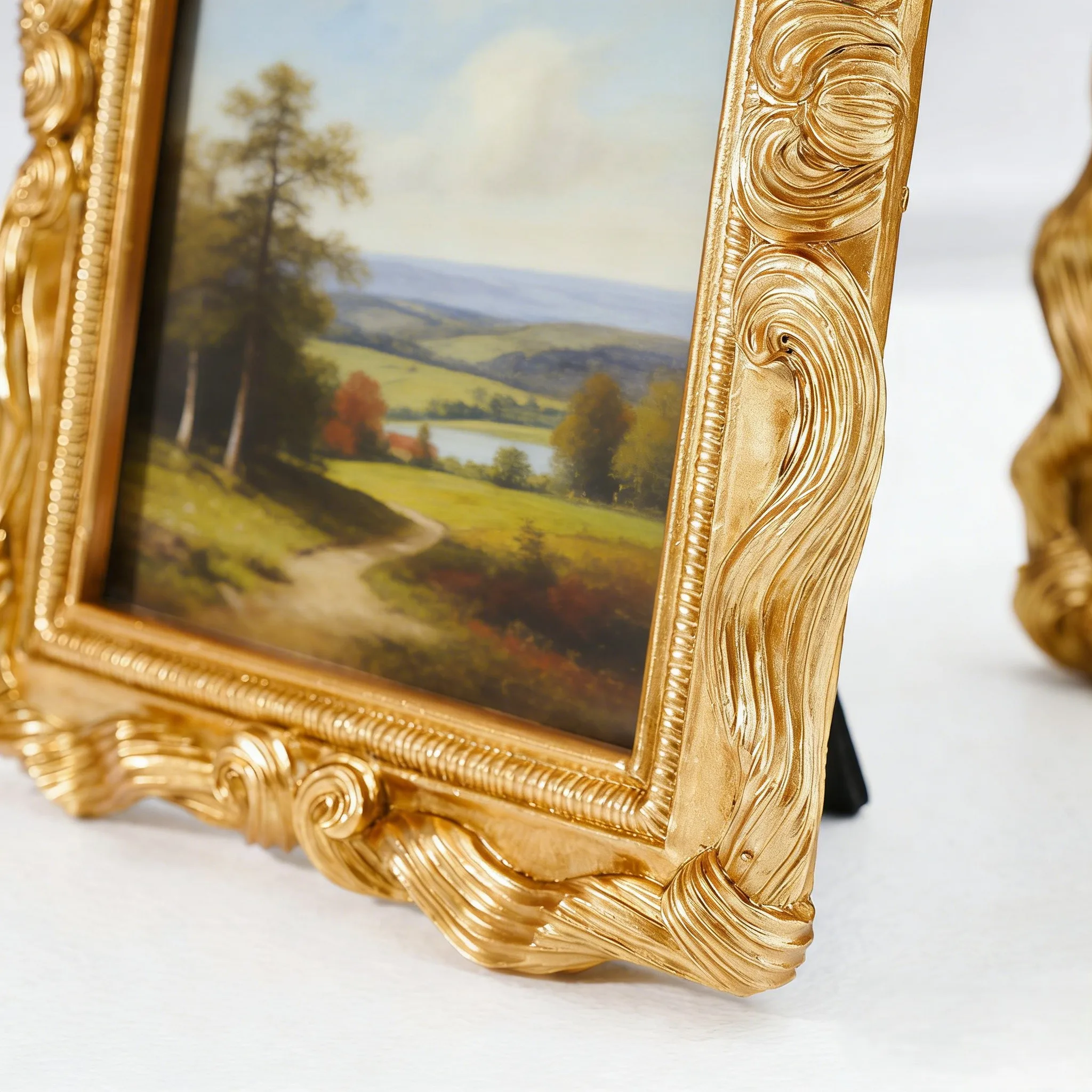 

Resin Picture Frame Gold Color with Ornamental Carved Bow Top and Floral Side Accents for Formal or Vintage Spaces