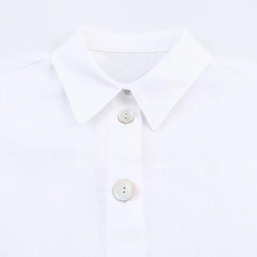 Camisa feminina de decoração de botão de emenda de cor sólida com gola e manga comprida verão nova camisa casual versátil