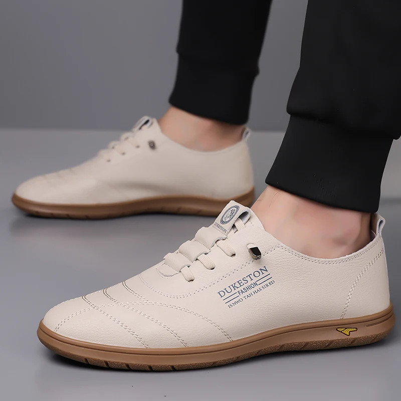 

2025 Luxury Men's Casual Sneaker Hollow Breathable White Soft-soled Leisure Leather Driving Shoes Fashion Male Loafers